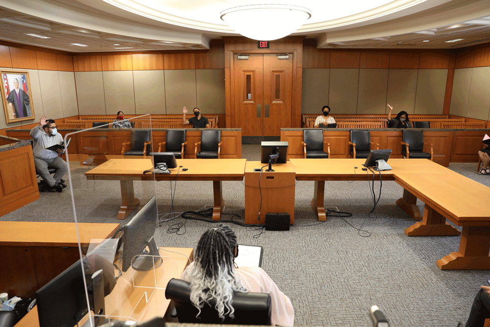 Jury Deliberating in a Courtroom